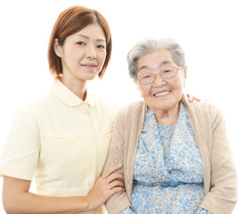 asian caregiver and senior woman smiling
